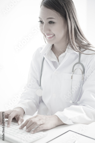 Young and professional doctor working in office