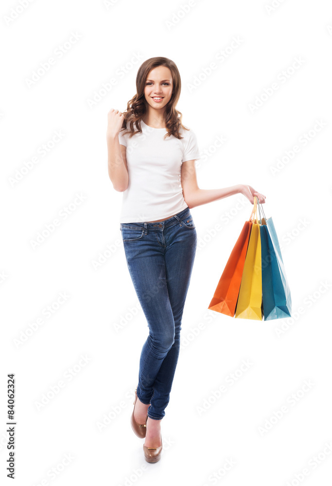 A young, attractive and happy shopping girl with bright shopping