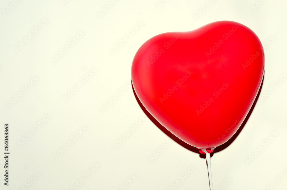 heart-shaped balloon against a white background