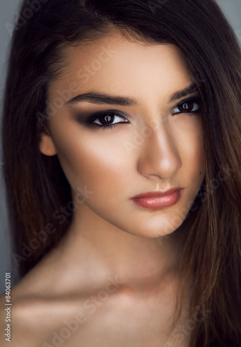Portrait of young beautiful woman with perfect clean skin 