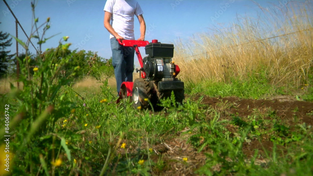 A man tills his field. A man tills his field.