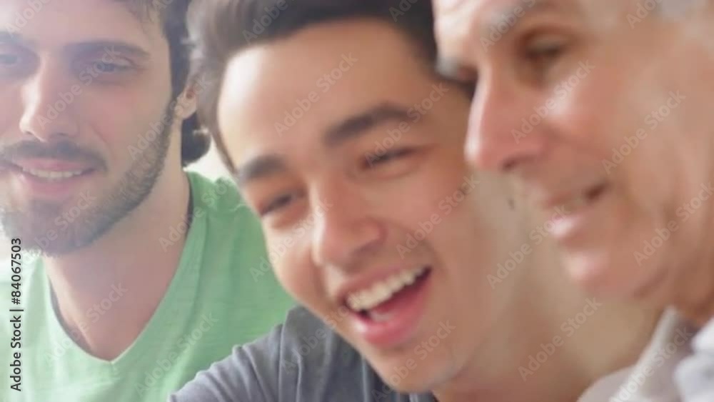 Grandfather laughing and smiling with grandsons Grandfather laughing and smiling with grandsons
