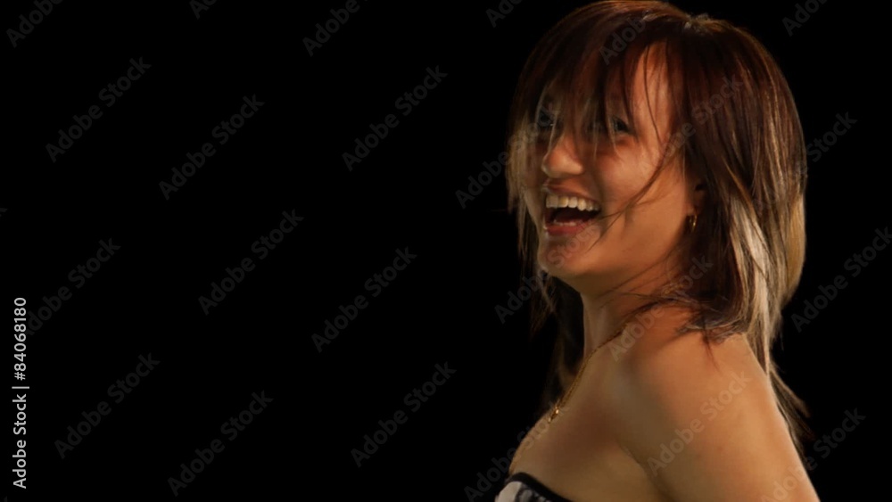 A woman dancing and shaking her hair with green screen alpha channel and mask