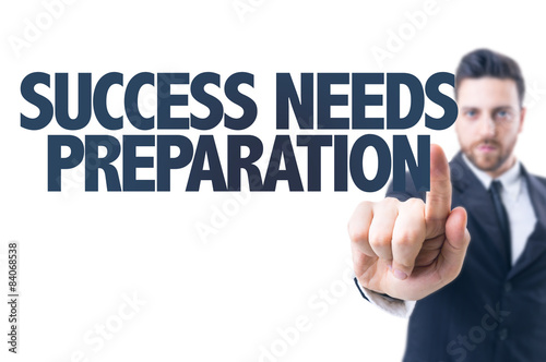 Business man pointing the text: Success Needs Preparation