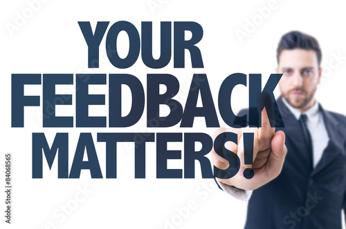 Business man pointing the text: Your Feedback Matters