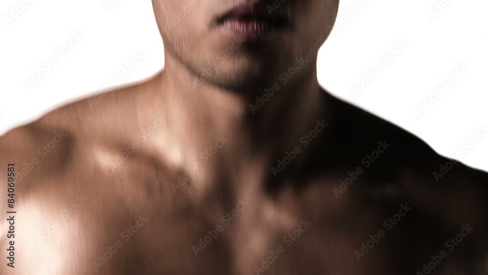 Medium shot of an athletic ethnic man running on a treadmill Medium shot of an athletic ethnic man running on a treadmill