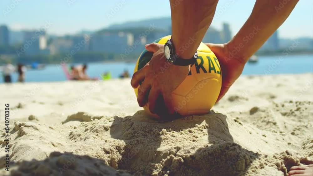 Soccer ball kicked in sand.