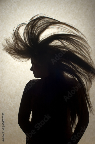фотографія Young Woman Flipping Hair