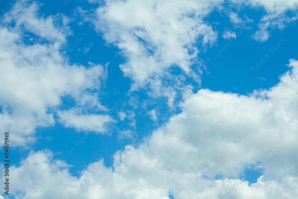 Obraz premium white fluffy clouds in the blue sky