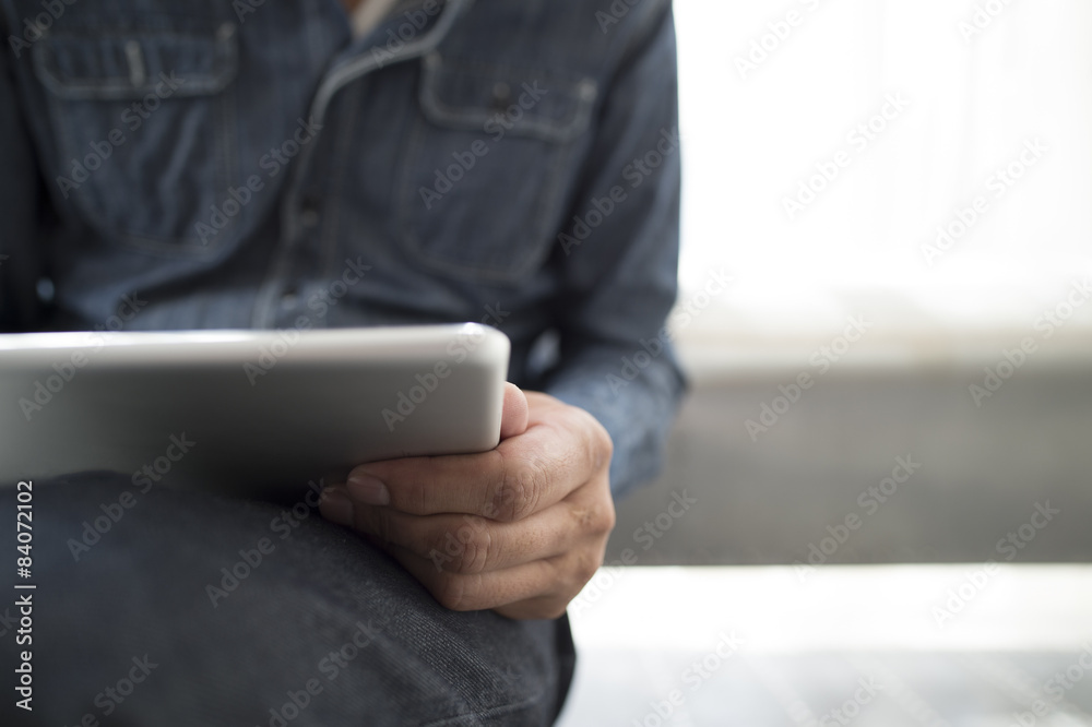 Men are infatuated with electronic tablet Men are infatuated with electronic tablet