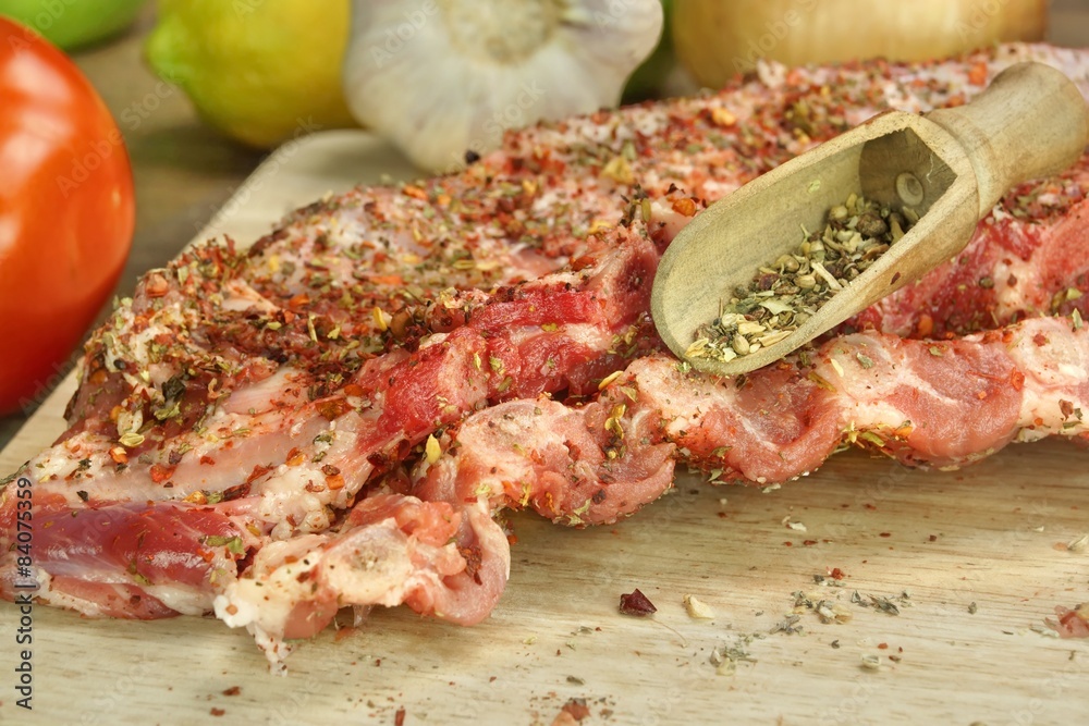 Raw Spare Ribs On Wood Cutting Board With Spices Raw Spare Ribs On Wood Cutting Board With Spices