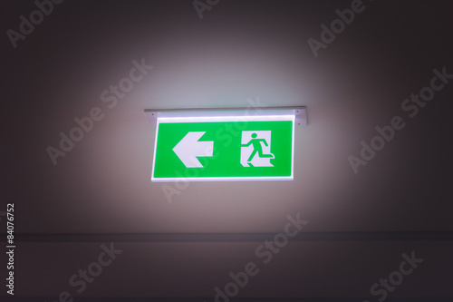 green fire exit light sign
