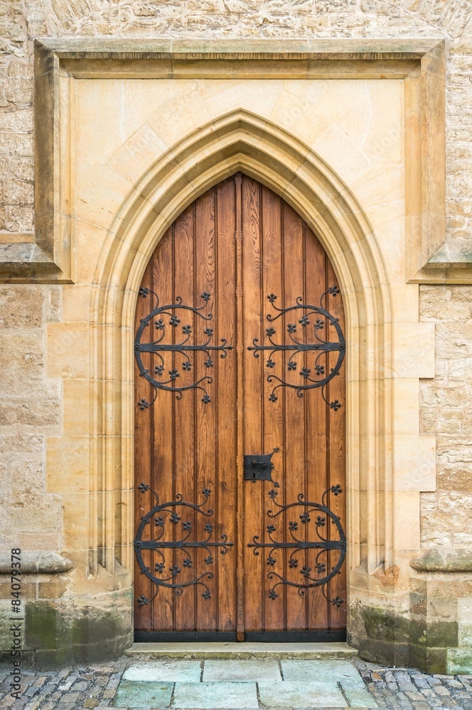 Old wooden door to the church