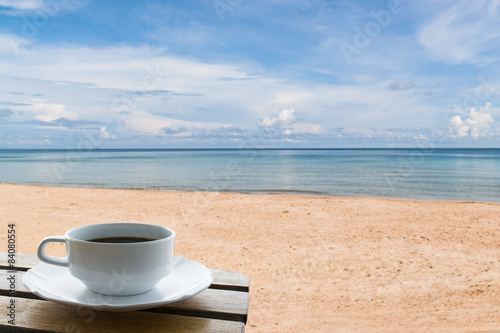 coffee cup on the beach background