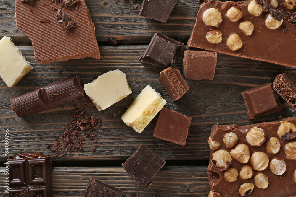 Set of chocolate with hazelnut on wooden table, top view Set of chocolate with hazelnut on wooden table, top view