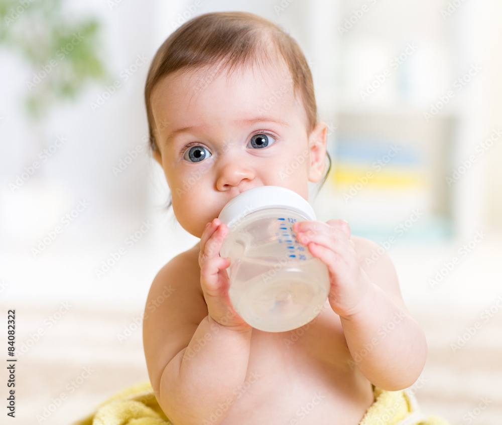 cute baby holding bottle and drinking water cute baby holding bottle and drinking water