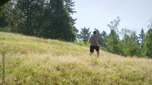 Fit and healthy young man runs through the park