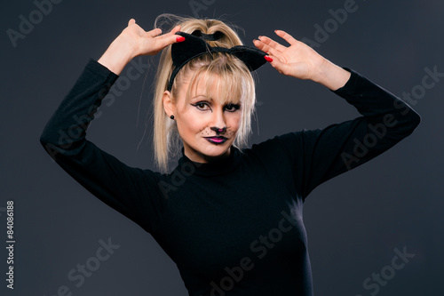 woman face disguised and made up of cat