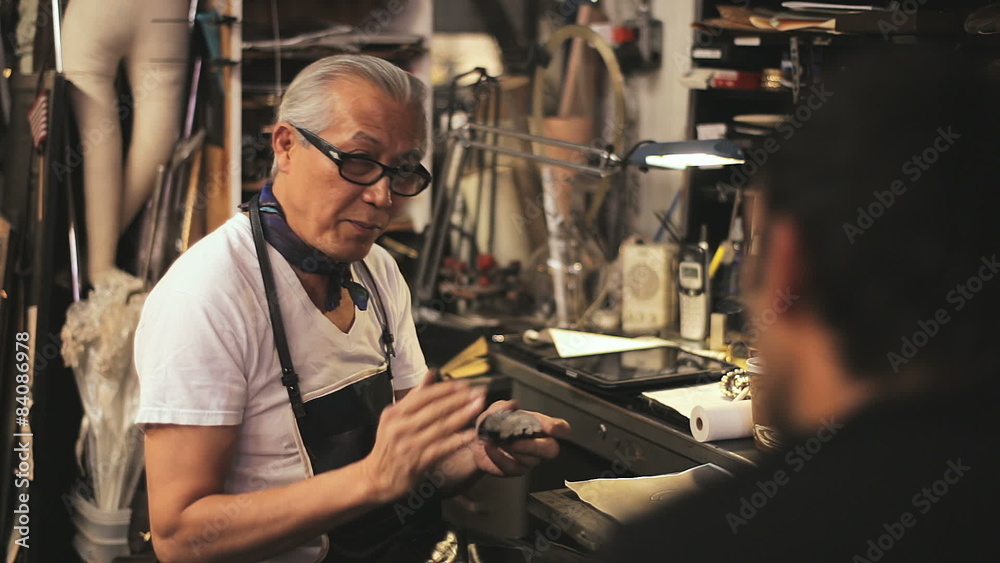 A student gets a lesson in design from a master craftsman