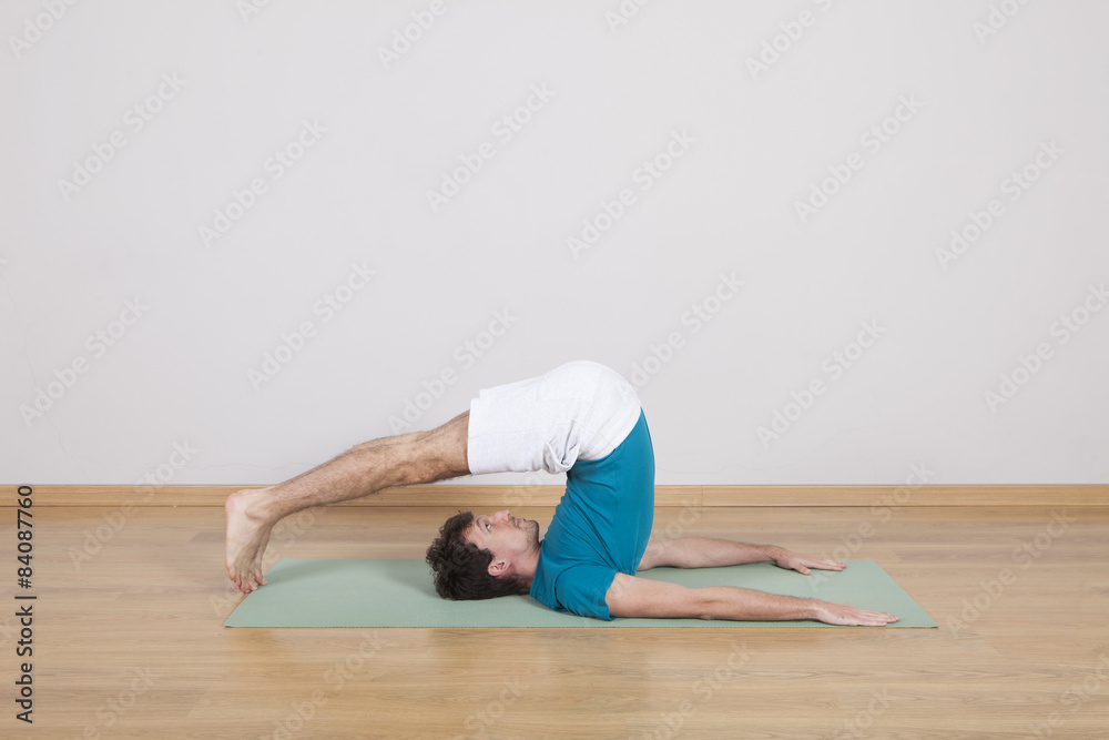 Naklejka premium man practicing pilates indoor, return to life sequence, 34 exerc