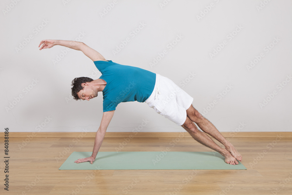 Naklejka premium man practicing pilates indoor, return to life sequence, 34 exerc