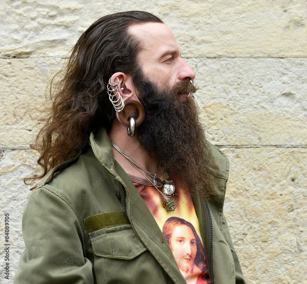 Naklejka premium Profil of a long bearded pierced Man