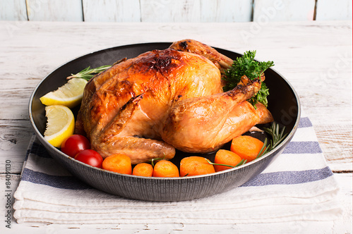 Roasted chicken and vegetables photo