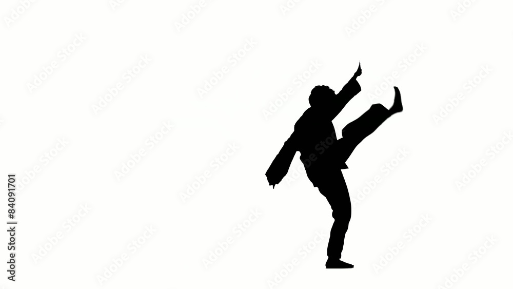 A karate or taekwondo  in a black kimono on a white background