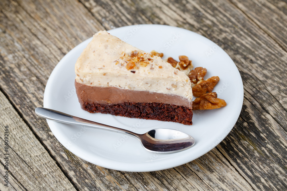 Tasty nuts cake on wooden background. Tasty nuts cake on wooden background.
