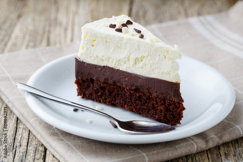 Vanilla cheesecake slice on wooden background. Vanilla cheesecake slice on wooden background.