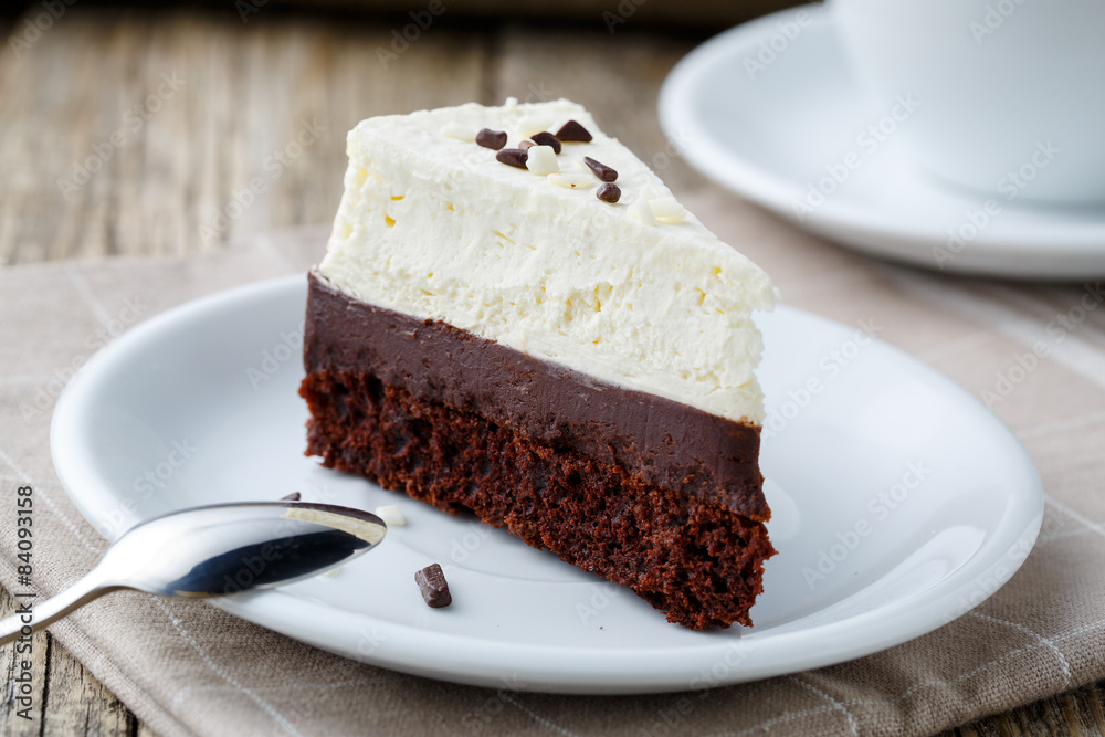 Vanilla cheesecake slice on wooden background. Vanilla cheesecake slice on wooden background.