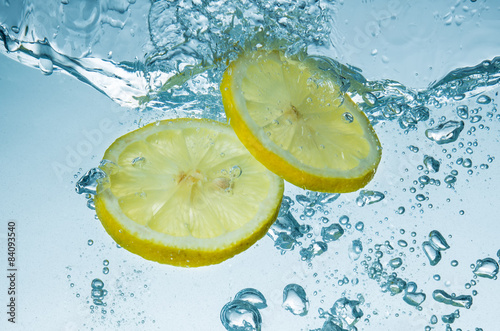 Lemons splashing into water #84093540