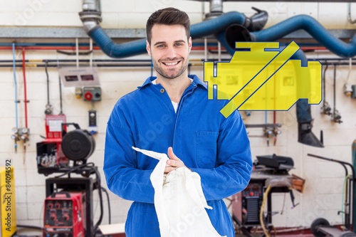 Composite image of male mechanic wiping hands with cloth © WavebreakMediaMicro