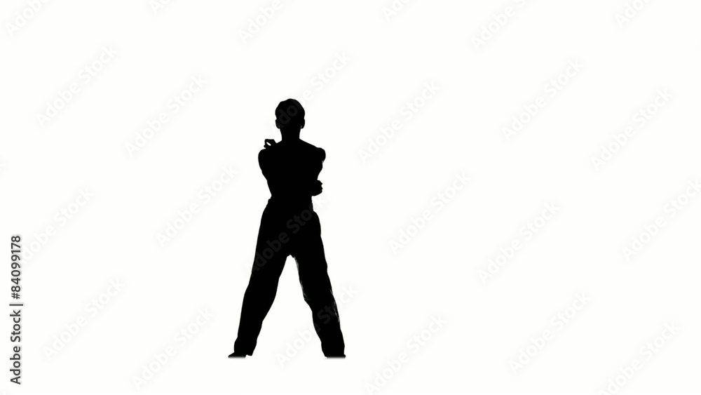 Man training taekwondo or karate, Silhouette, Slow motion Man training taekwondo or karate, Silhouette, Slow motion