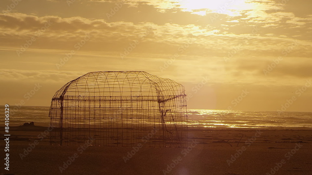 The sun sets slowly behind the ocean in this beautiful landscape shot The sun sets slowly behind the ocean in this beautiful landscape shot