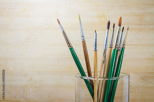 Photo of paint brushes in a glass