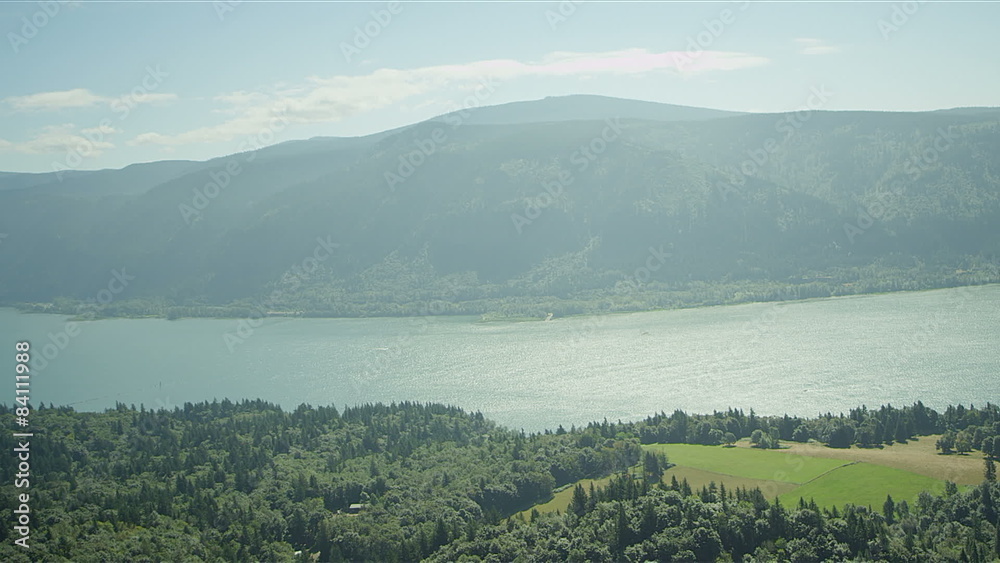 Wide shot of a mountain wilderness overlooking a lake Wide shot of a mountain wilderness overlooking a lake
