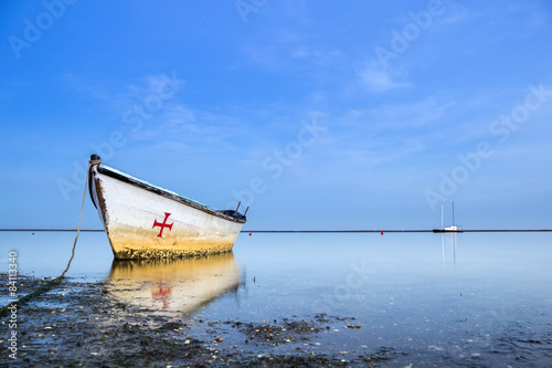 Boats in Ria Formosa wetlands landscape, Algarve.