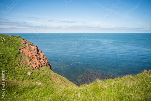 Fels im Meer, wolkenloser Himmel photo