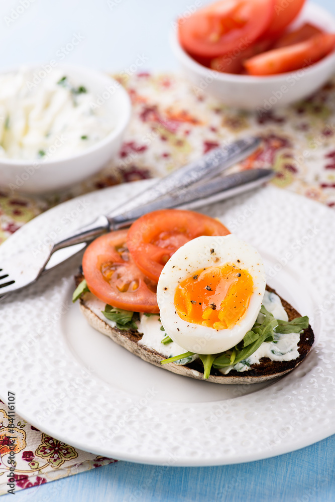 Rye toast sandwiches with egg and soft cheese