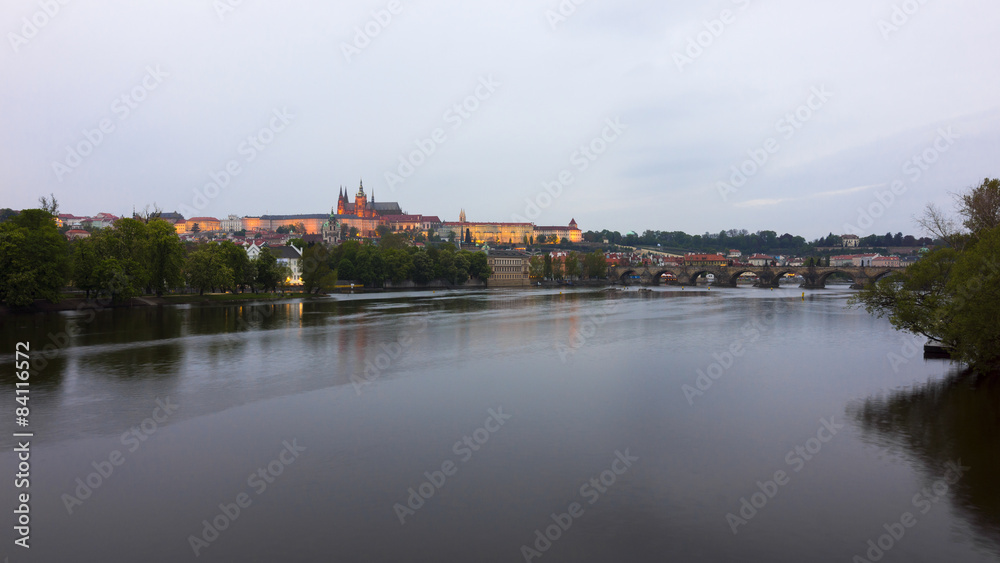 Vltava River, Charles Bridge and Prague Castle at twilight