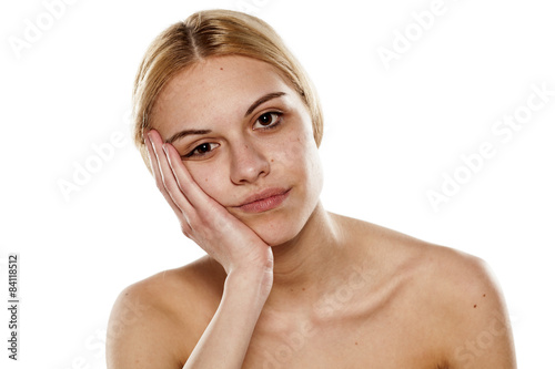 portrait of a young bored woman with no makeup photo