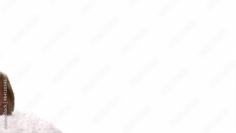 A baby lays on its back with its legs in the air on a white blanket in a white room, panning right to left in slow motion A baby lays on its back with its legs in the air on a white blanket in a white room, panning right to left in slow motion