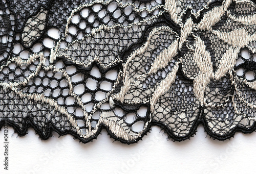 The macro shot of the white and black lace texture material