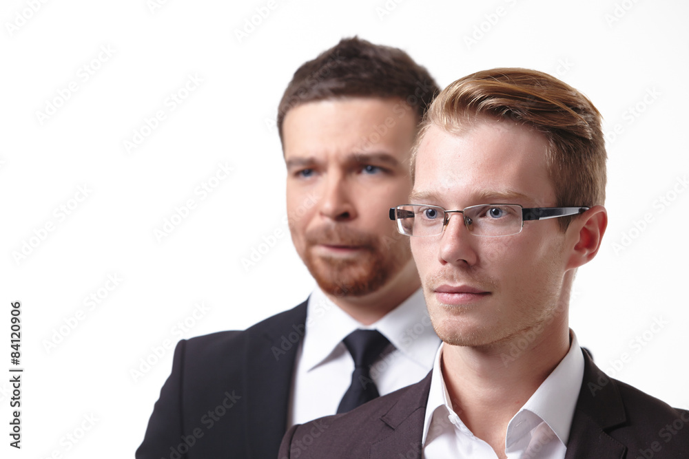 close-up portrait of two young businessmen close-up portrait of two young businessmen