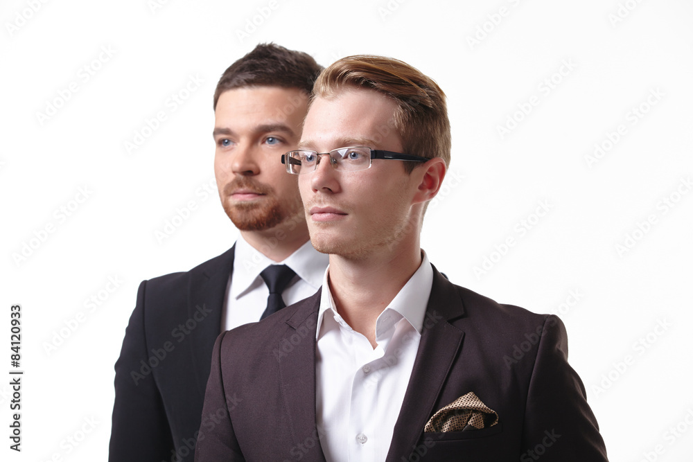 close-up portrait of two young businessmen close-up portrait of two young businessmen