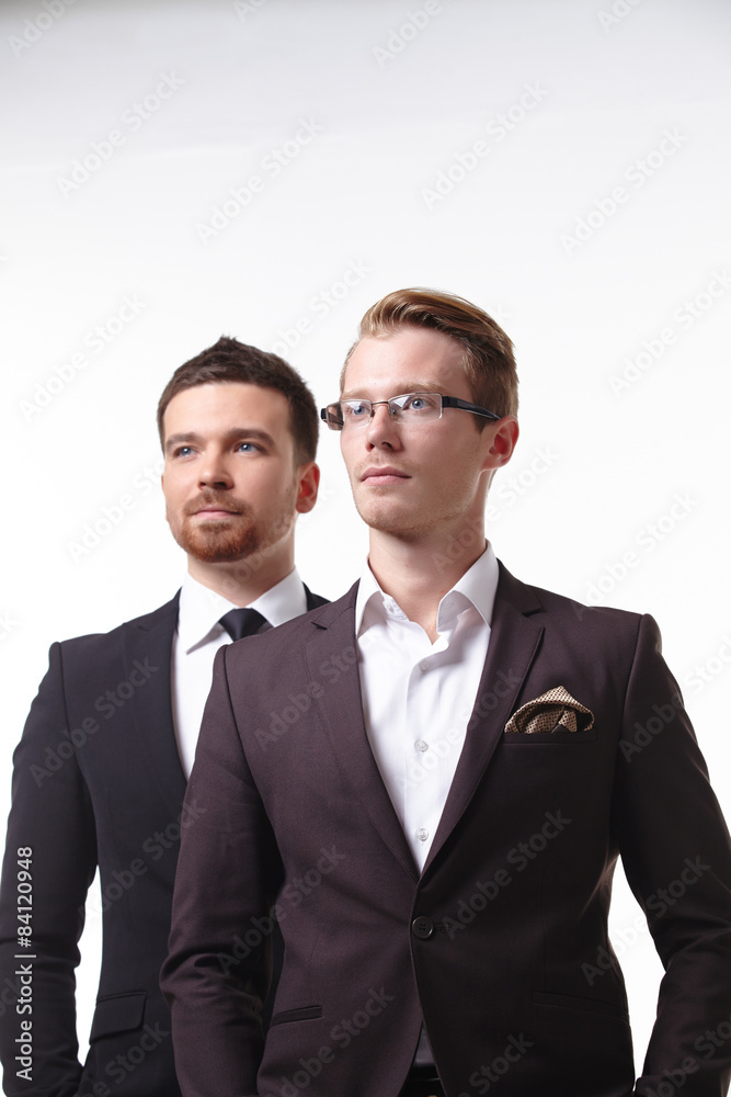 close-up portrait of two young businessmen close-up portrait of two young businessmen
