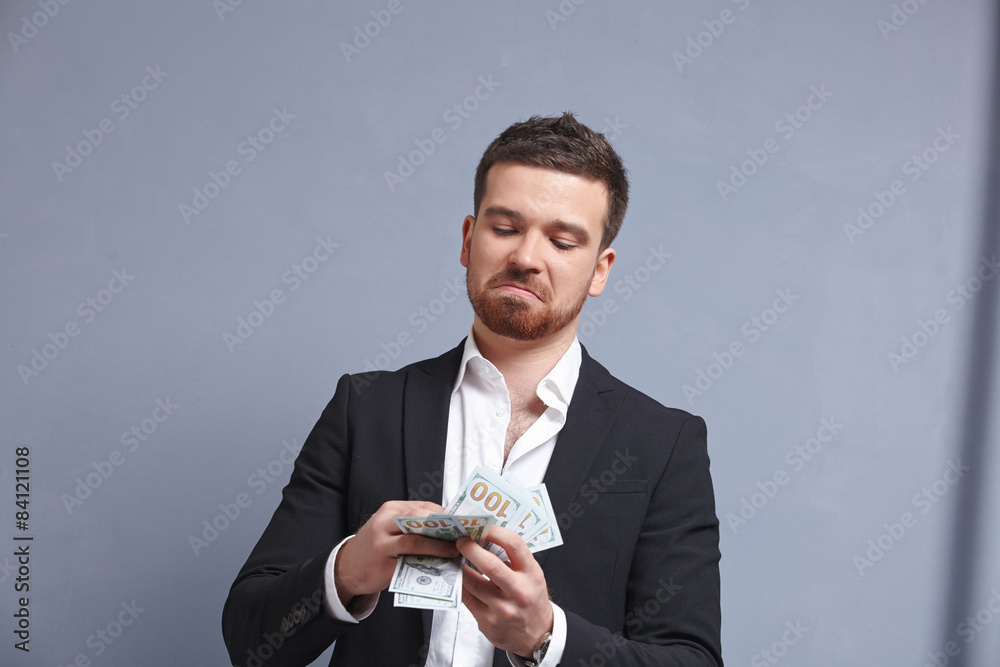 Money in the hands of a cheerful businessman Money in the hands of a cheerful businessman