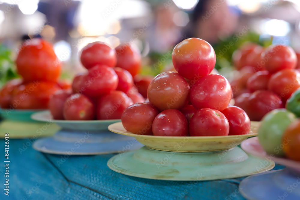 Ripe tomatoes at a farmer's market Ripe tomatoes at a farmer's market