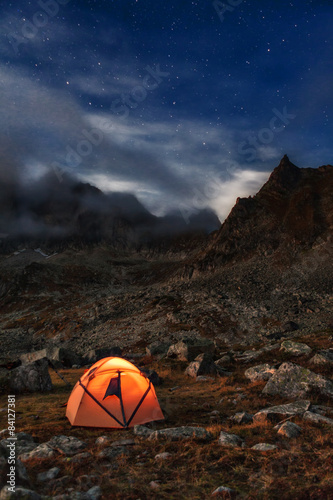 Tourist camping at night in the mountains